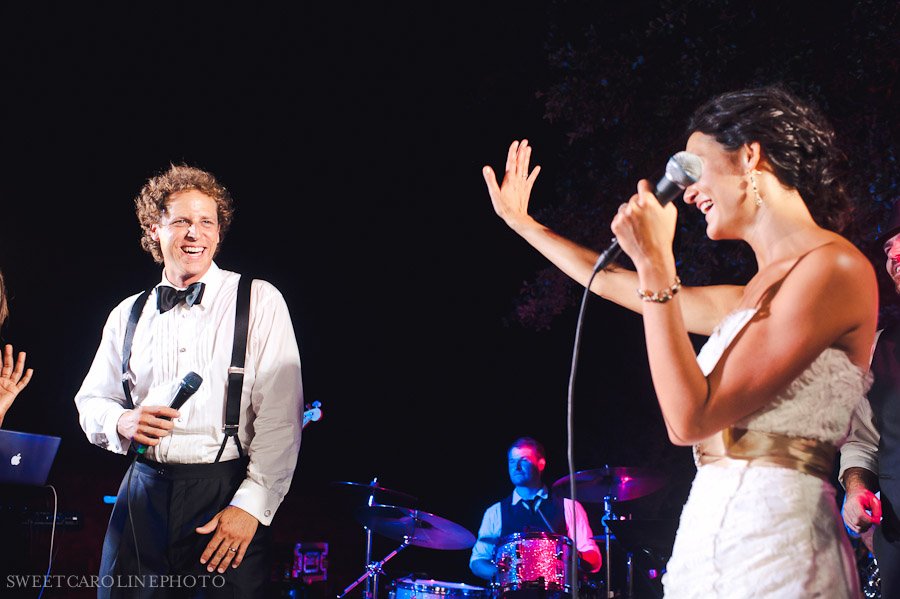 bride and groom singing on stage