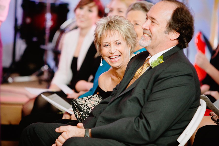 mother of groom laughing during ceremony