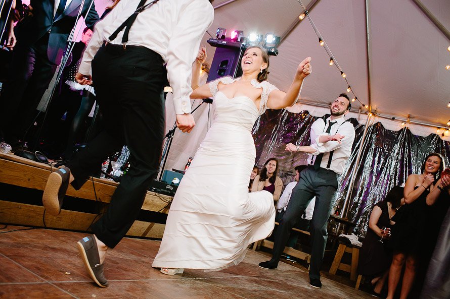 bride and groom playing jump rope