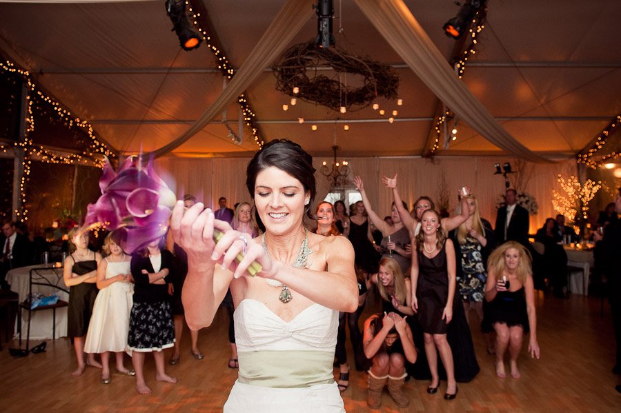 Bride tossing bouquet at Barr Mansion
