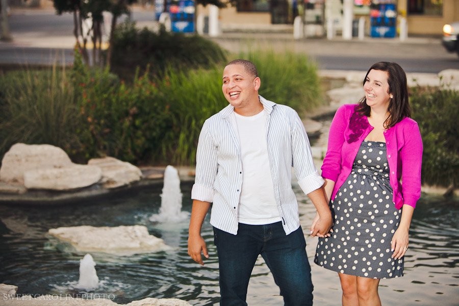 couple laughing during engagement photo shoot