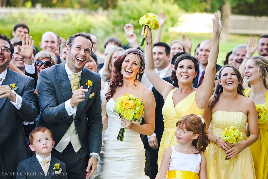 bridal party laughing at wedding outside