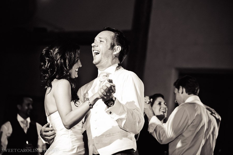 groom laughing and black and white