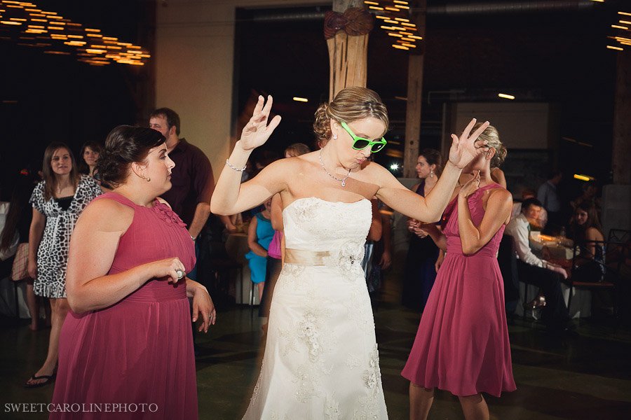bride in sunglasses on dance floor