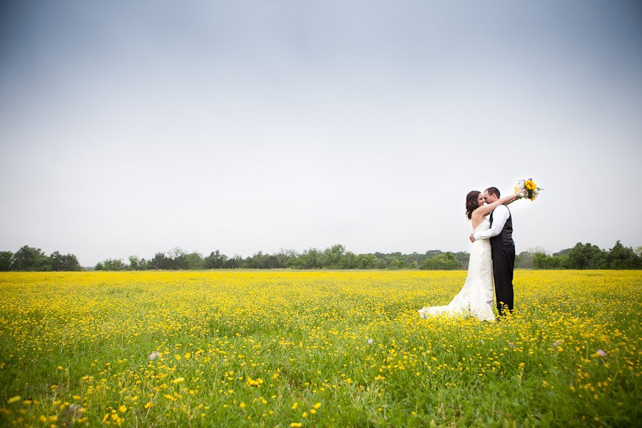 Bride and Groom in a wildflower field at Texas Old Town