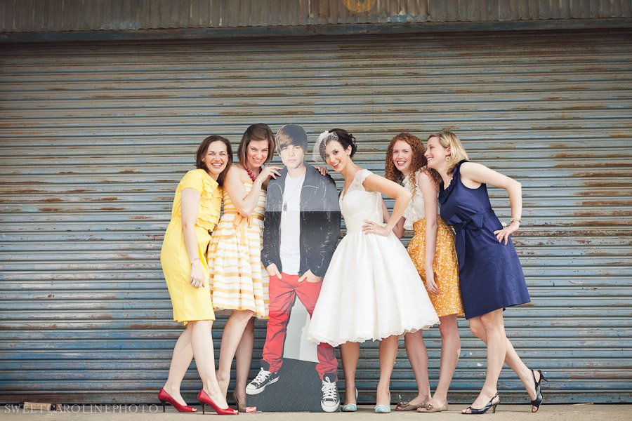 bride and bridesmaids with Justin Bieber cut out