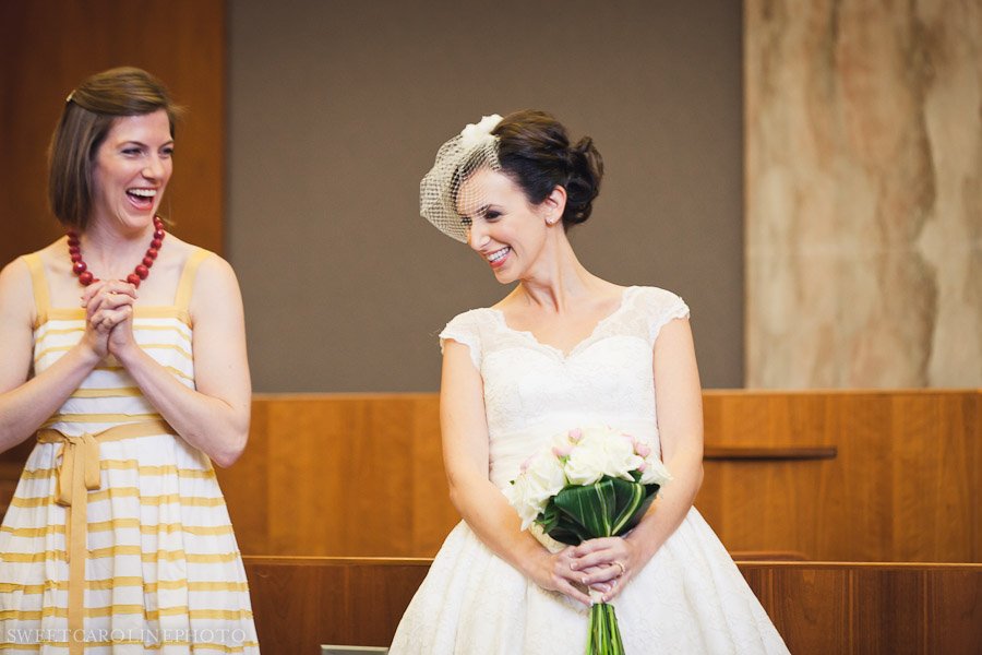 bride laughing during courthouse wedding