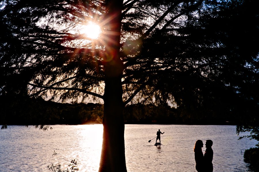 silhouette engagement photo with standup paddle board