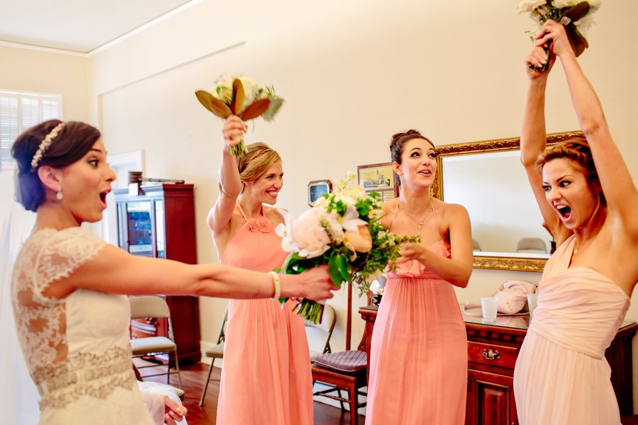 bridesmaids in coral dresses
