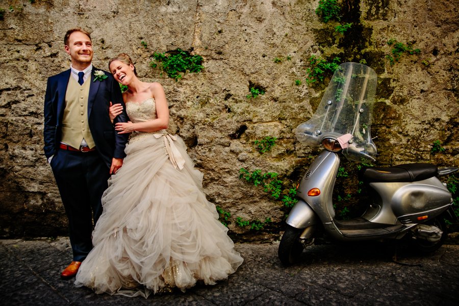 bride and groom with italian vespa