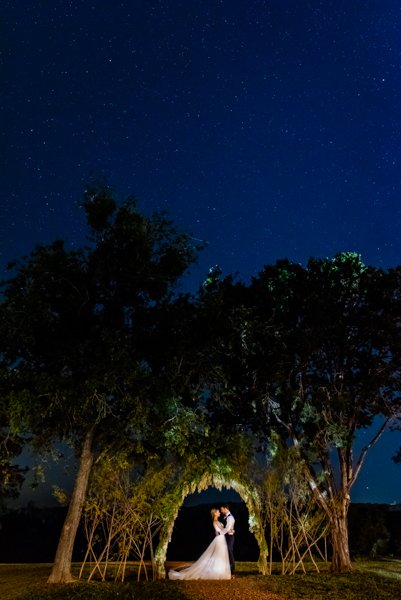 bride and groom portrait under the stars