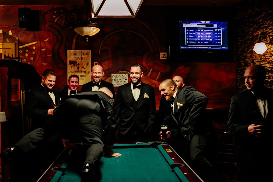 groom and groomsmen with pool table