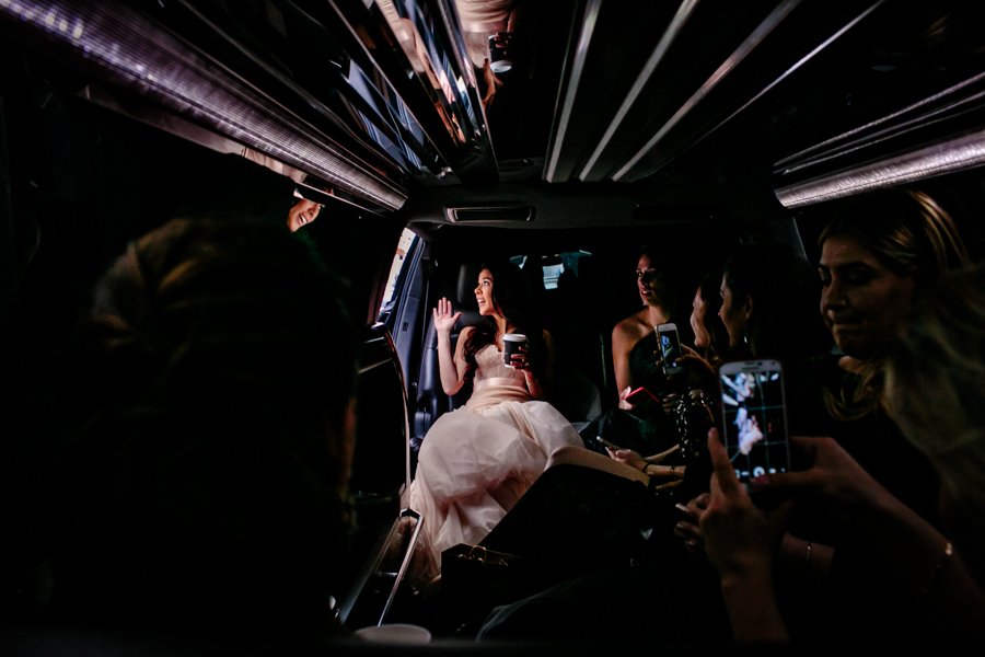 bride and bridesmaids in limo