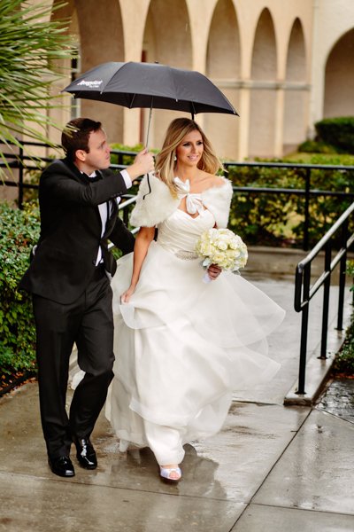 bride and groom on rainy day
