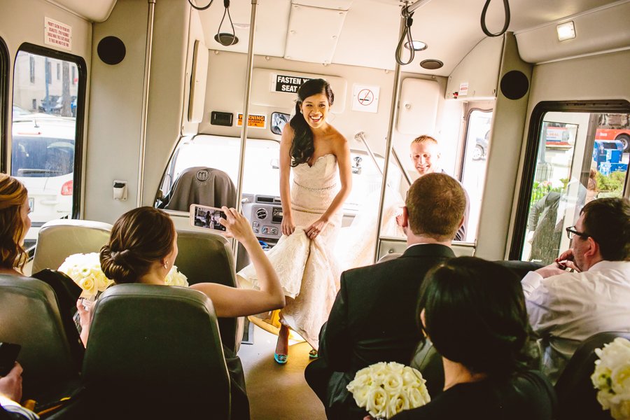 bride and groom in wedding bus