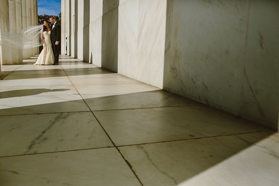 bride and groom at lincoln memorial