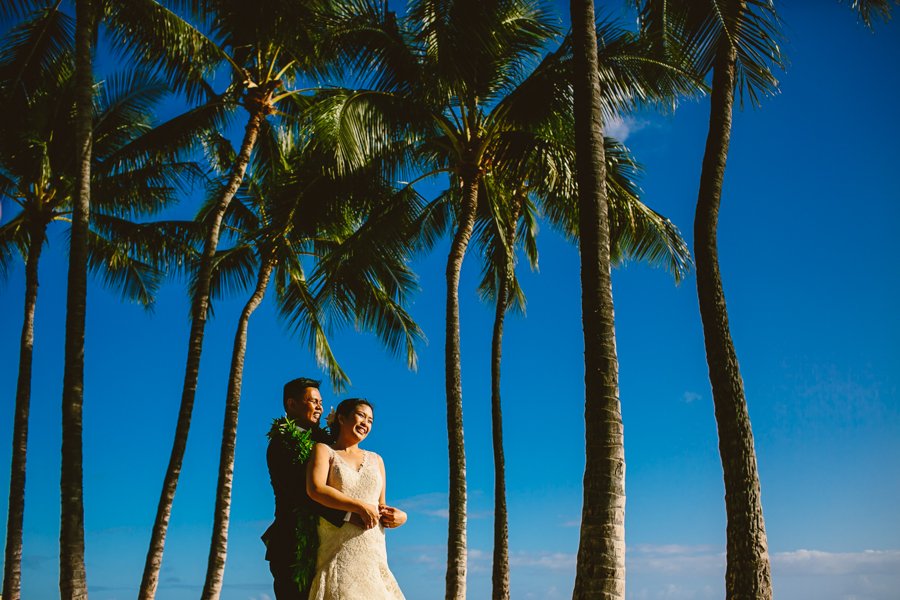 bride and groom with palm trees