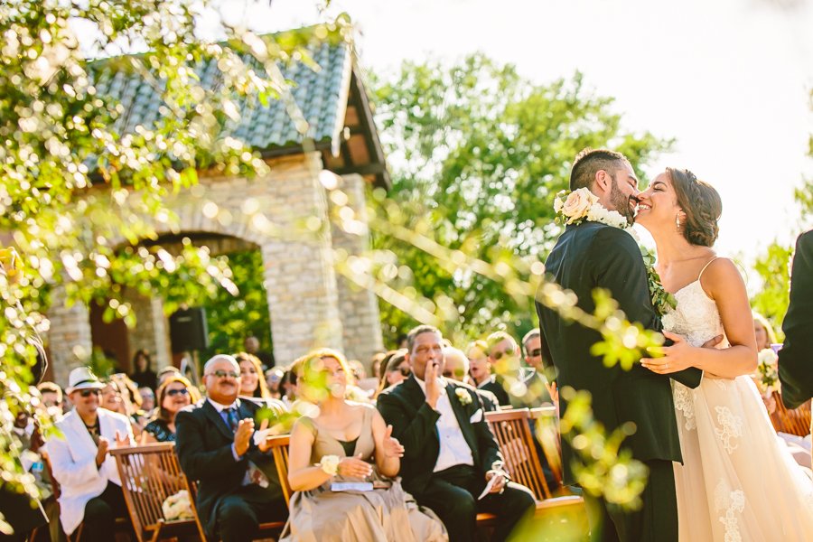 bride and groom kiss at camp lucy