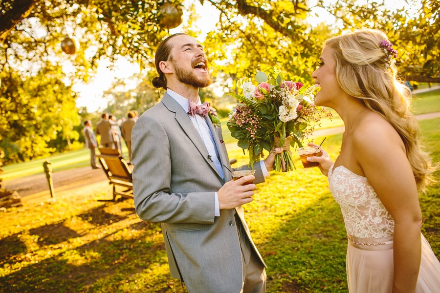 bride and groom laughing at pecan springs