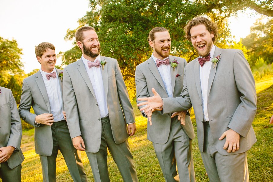groomsmen laughing at hill country wedding