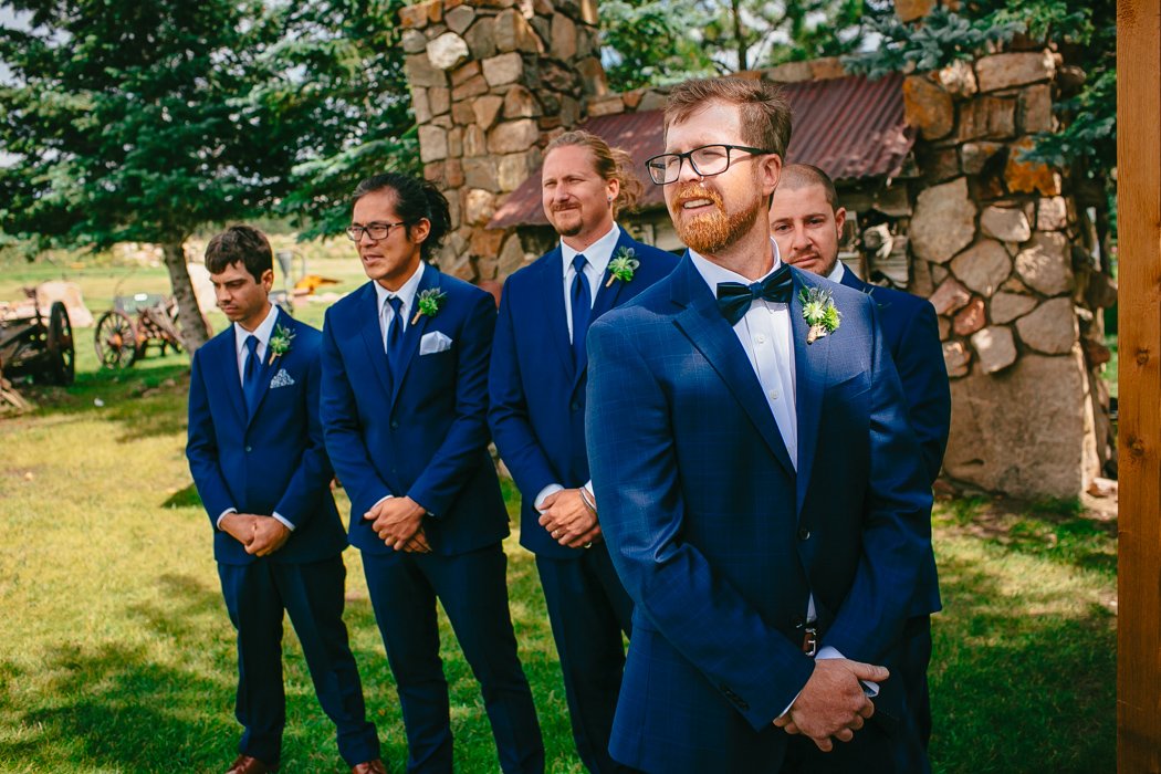 ginger groom in blue suit at wedding