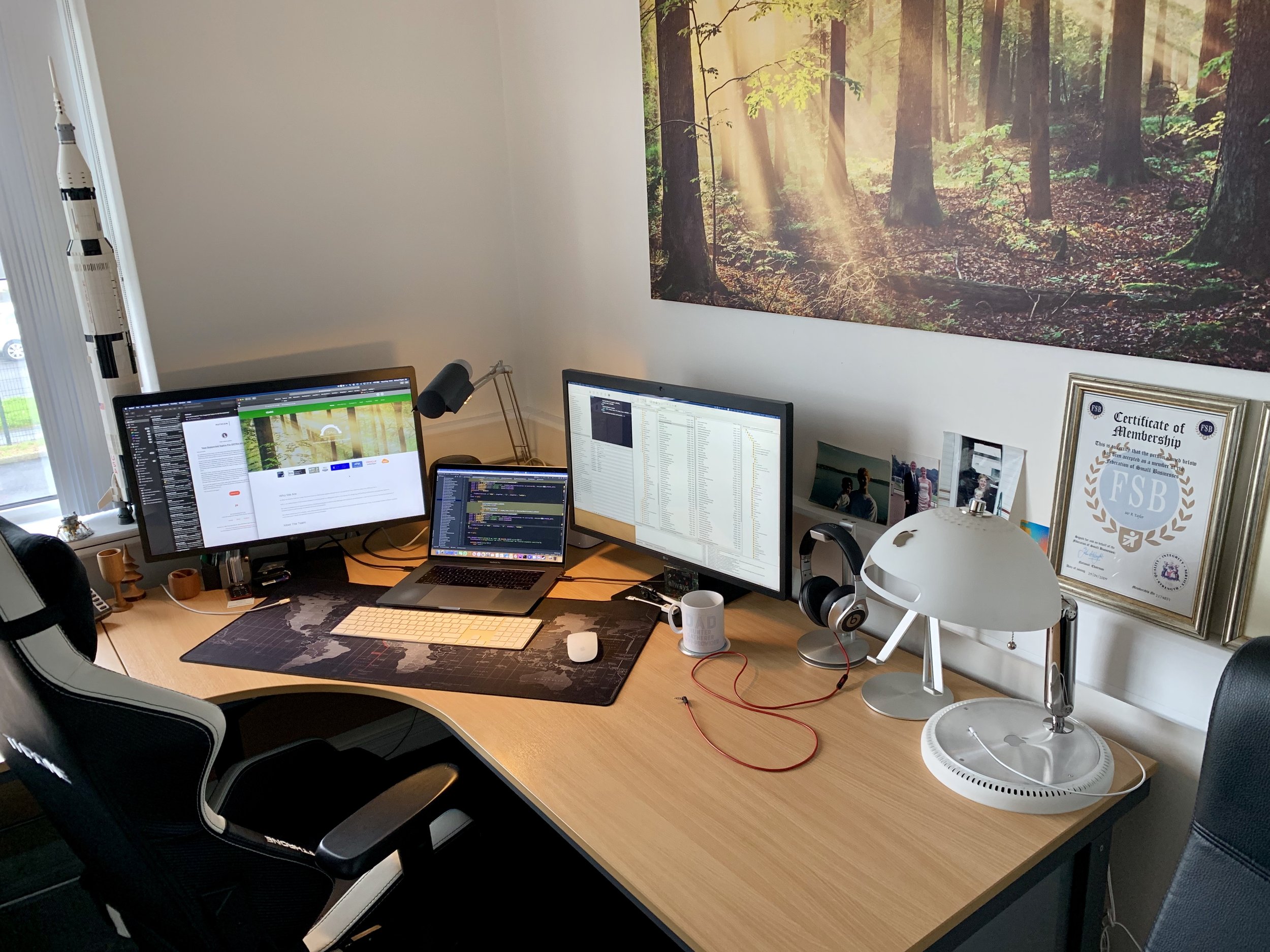 Desk with 5k screens, MacBook Pro, Lego and iLamp