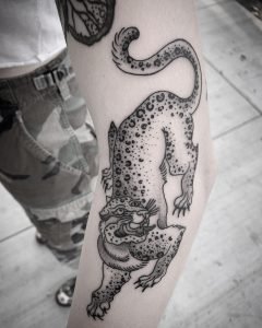 Blackwork cat tattoo by Jesse Iris at Paper Crane in Long Beach, CA
