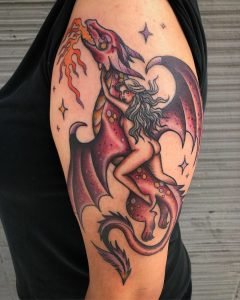 Game of Thrones inspired tattoo of a naked woman riding a red dragon--by Lindsey Morehead.