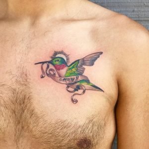 Full color hummingbird chest tattoo by Suzanne Shifflett of Long Beach.