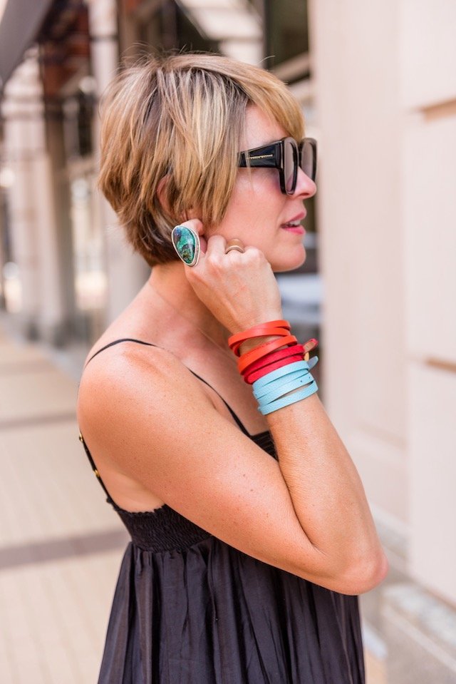 Get Stacked: Victoria Emerson Sale Favorites by popular fashion blog, Seersuckers and Saddles: image of a woman standing outside and wearing Victoria Emerson jewelry