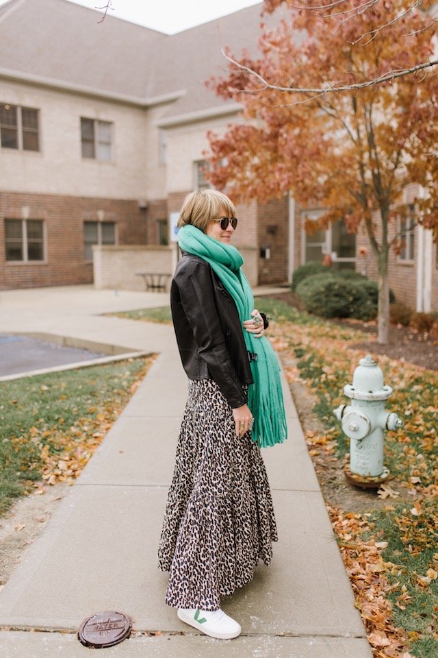 The Anthropologie Wish List by popular Indianapolis life and style blog, Seersucker and Saddles: image of a woman outside wearing a Anthropologie Mimi Fringed Wrap Scarf.