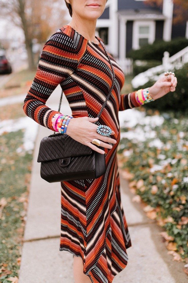 The Anthropologie Wish List by popular Indianapolis life and style blog, Seersucker and Saddles: image of a woman outside wearing a Anthropologie Parkside Knit Dress.