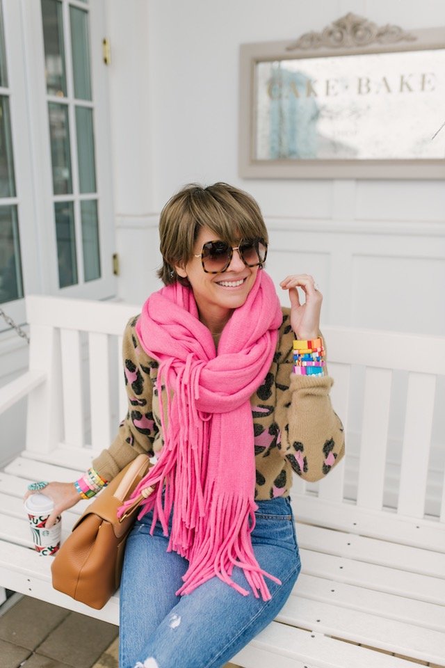 The Anthropologie Wish List by popular Indianapolis life and style blog, Seersucker and Saddles: image of a woman outside wearing a Anthropologie Mimi Fringed Wrap Scarf.