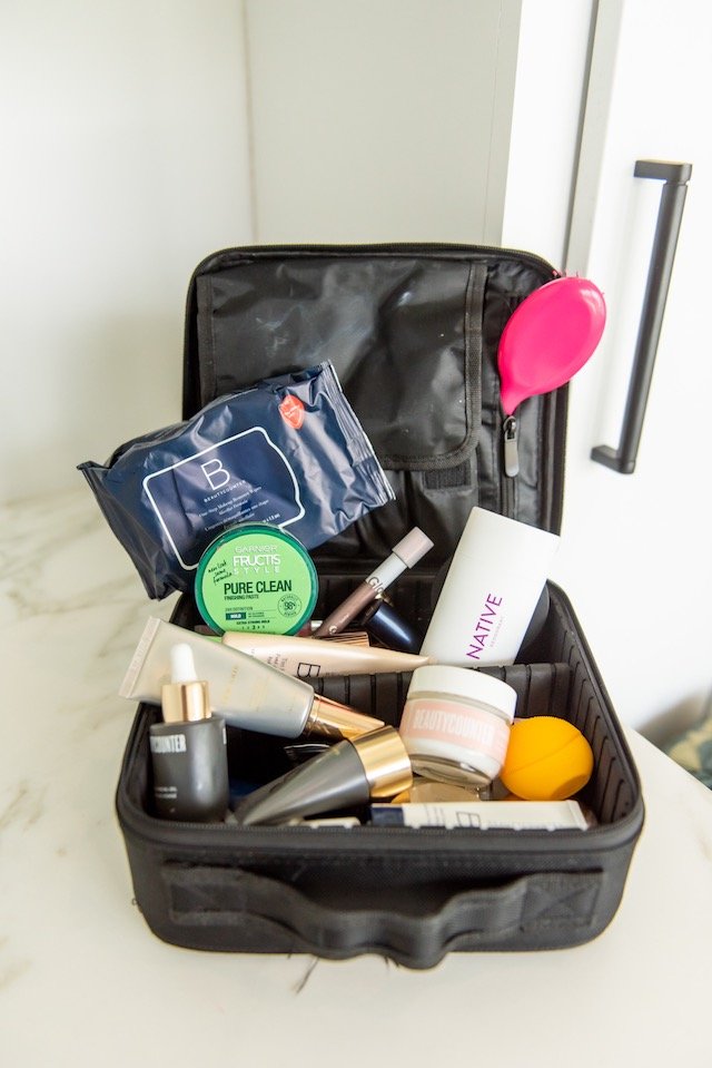 Gym Bag Essentials by popular Indianapolis life and style blog, Seersucker and Saddles: image of a Amazon Relavel Travel Makeup Train Case Makeup Cosmetic Case Organizer Portable Artist Storage Bag  with Native Deodorant, Amazon Wet Brush, and Beauty Counter products. 