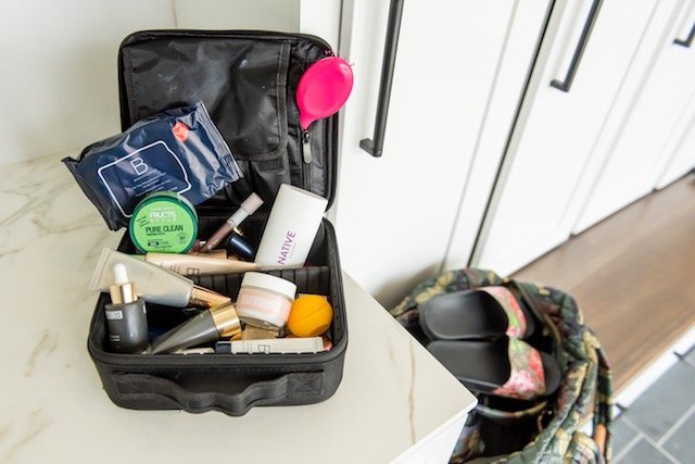 Gym Bag Essentials by popular Indianapolis life and style blog, Seersucker and Saddles: image of a Amazon Relavel Travel Makeup Train Case Makeup Cosmetic Case Organizer Portable Artist Storage Bag  with Native Deodorant, Amazon Wet Brush, Nordstrom Gucci slide sandals, and Beauty Counter products. 