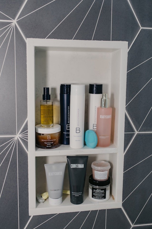 Clean Beauty Movement by popular Indianapolis beauty blog, Seersucker and Saddles: image of a shower shelf with Beautycounter products on it. 