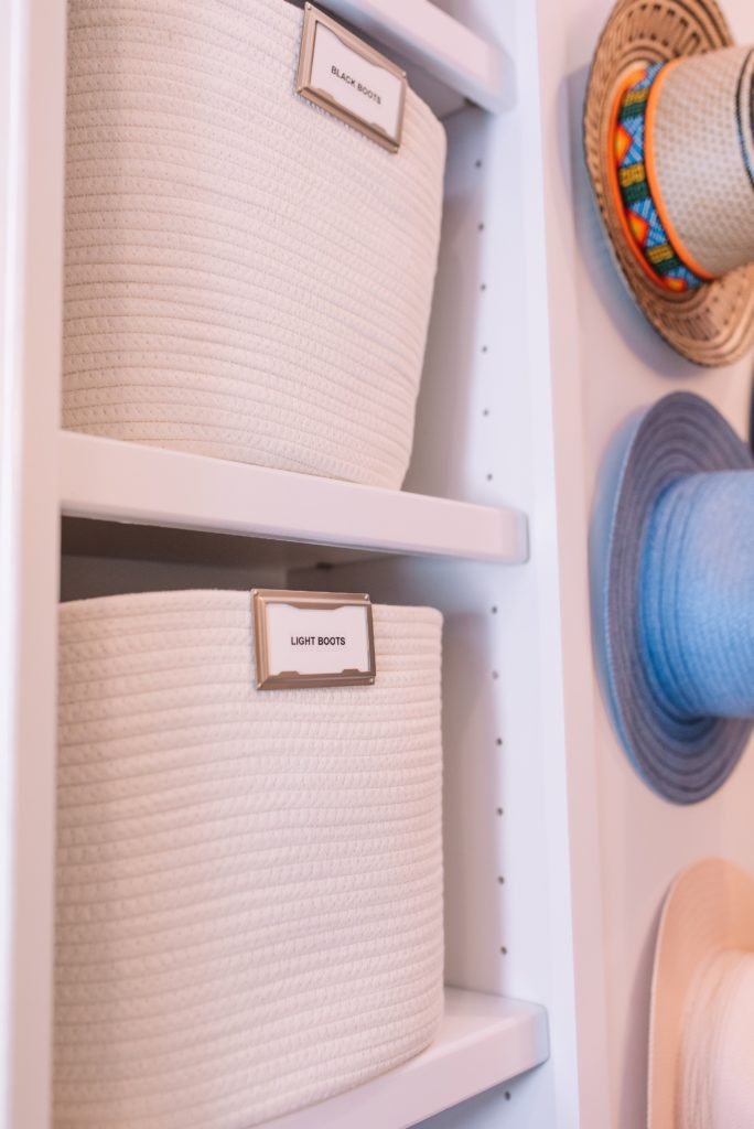 Closet Layout by popular Indianapolis life and style blog, Seersucker and Saddles: image of labeled rope bins on white shelving in a walk-in closet. 