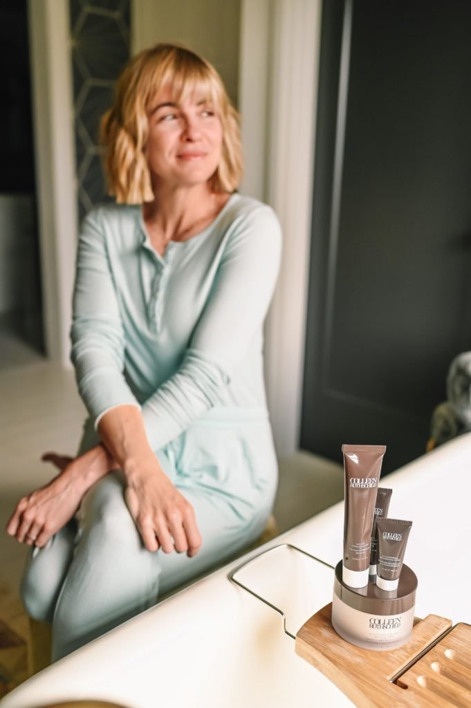 Colleen Rothschild BOGO by popular Indianapolis beauty blog, Seersucker and Saddles: image of a woman wearing a light blue loungewear set and sitting next to some Colleen Rothschild products. 