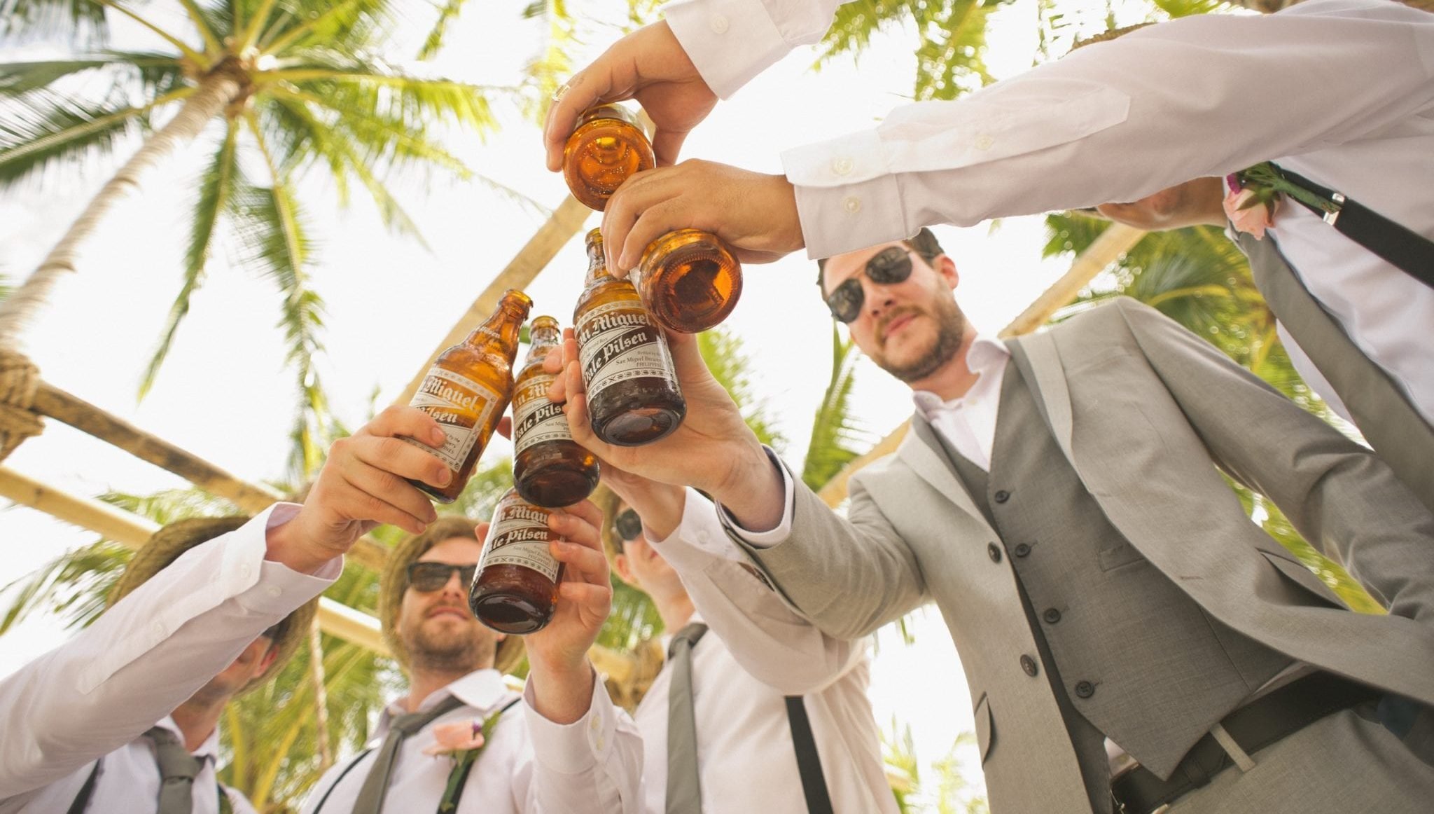 Men on a beach wedding