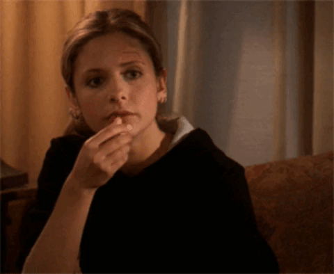 Buffy the Vampire Slayer eating popcorn and watching a movie