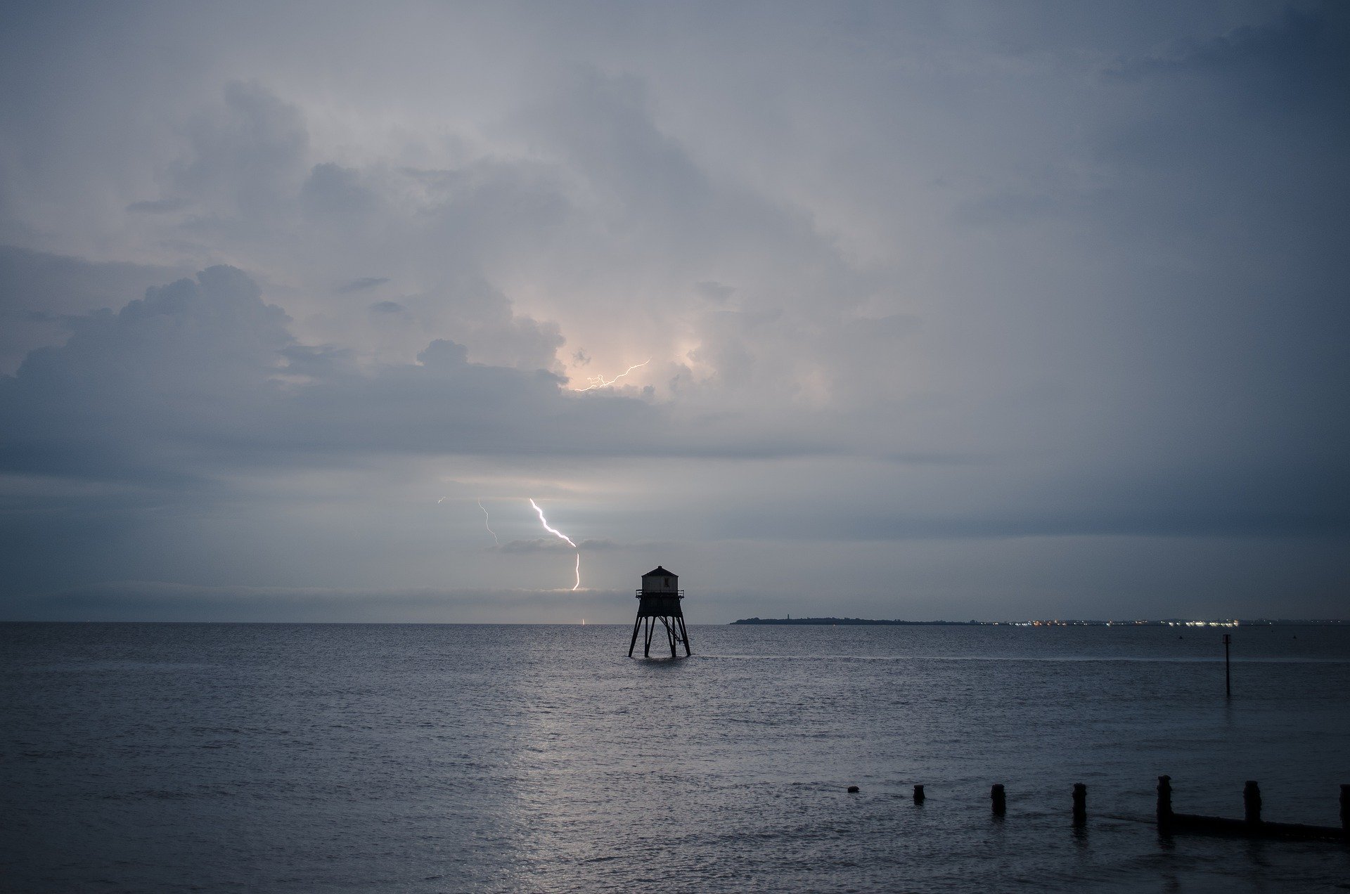 Lighting storm over water, expressing shock of the day and the year