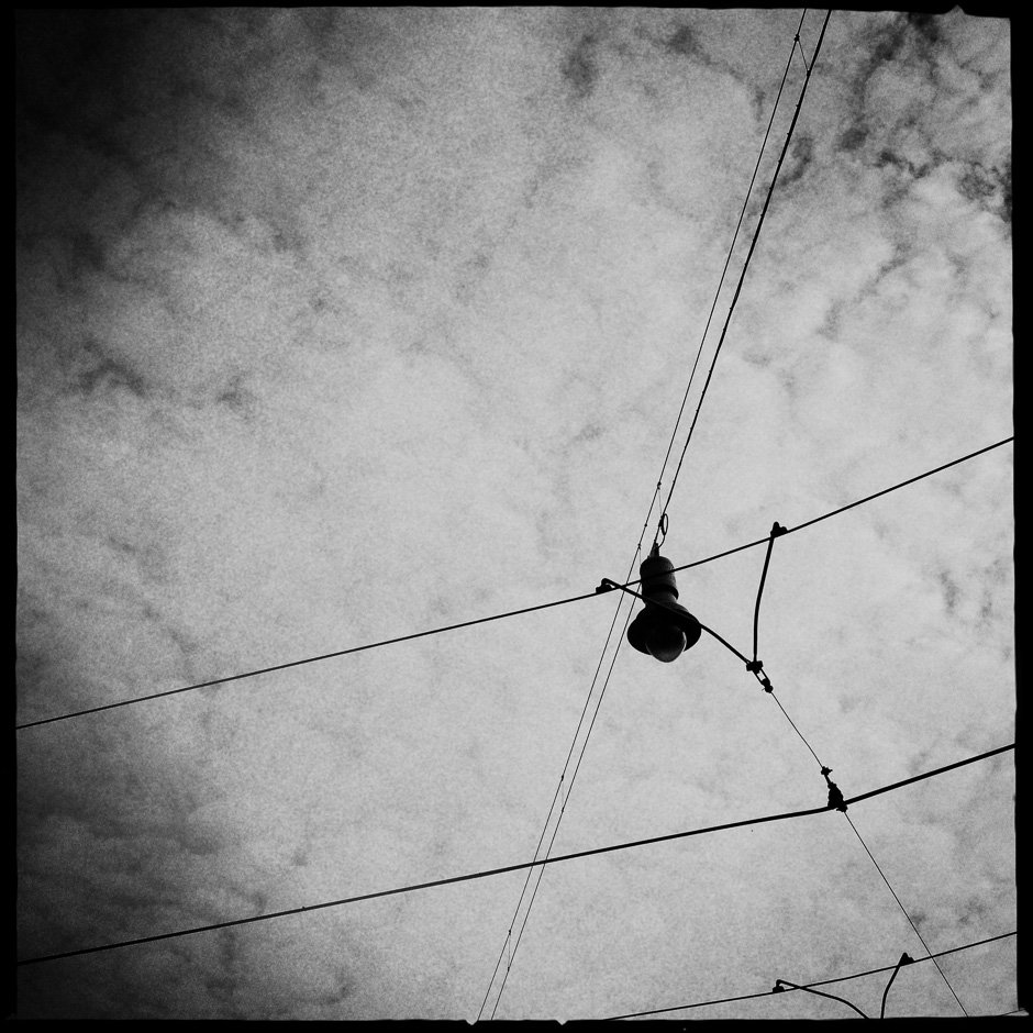 Black and white photograph of a overhead street light in Amsterdam taken with the iPhone and Hipstamatic