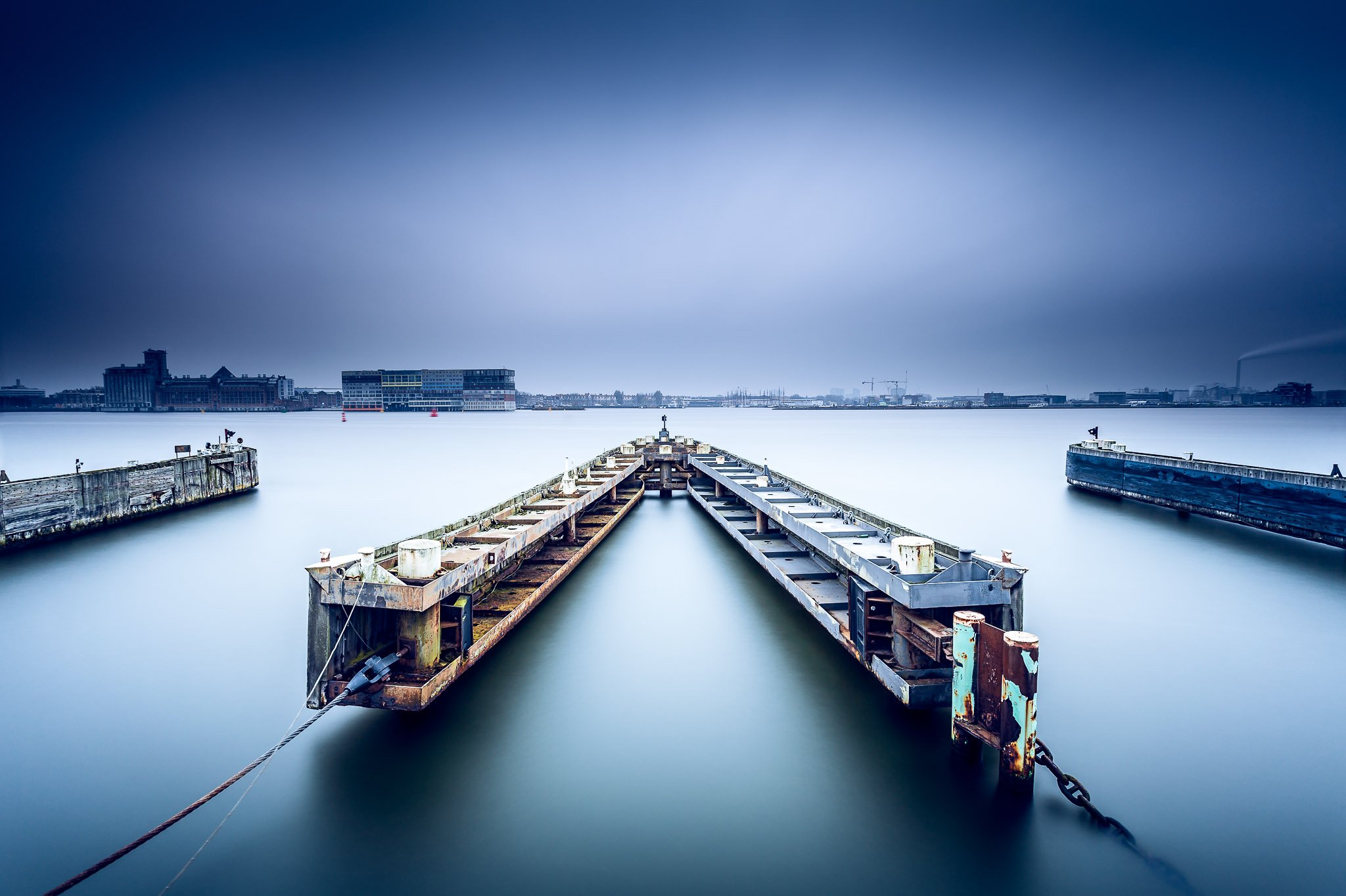 A long exposure image of a ferry doc in Amsterdam