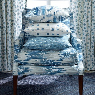 full-service-interior-designer-southlake-tx-how-to-choose-fabrics-upholstered-chair-with-pillows-blue-patterns-traditional-design