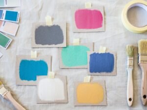 Paint color chip samples taped to a wall