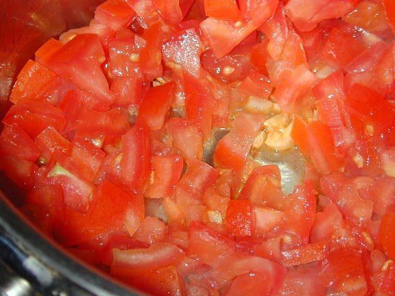 Saute tomatoes and garlic