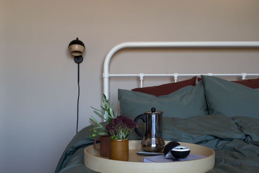 How to style your home for winter with breakfast in bed with dark green cotton bedding and a tray with coffee, from NABO shop
