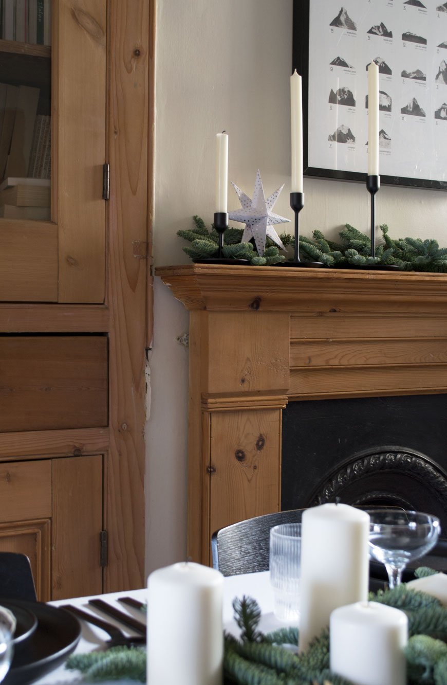 Festive dressed Edwardian mantlepiece sharing styling tips for Nordic Christmas decorations.
