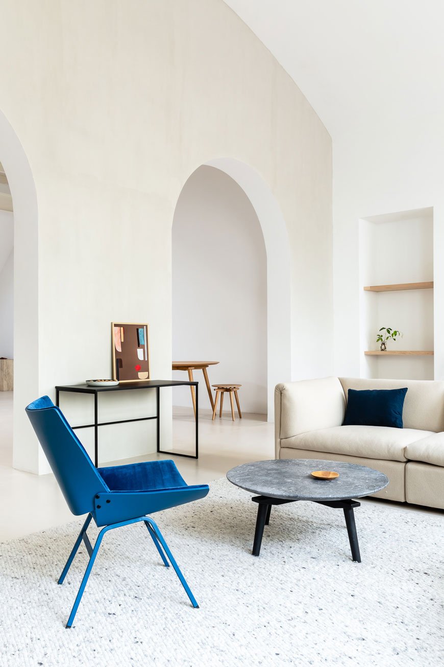 The plywood shell lounge designed by Rex Kralj, upholstered in a blue velvet. 