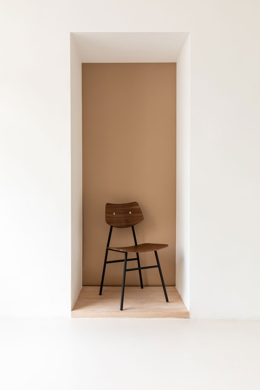Mid-century modernist chair in walnut designed by Rex Kralj. 